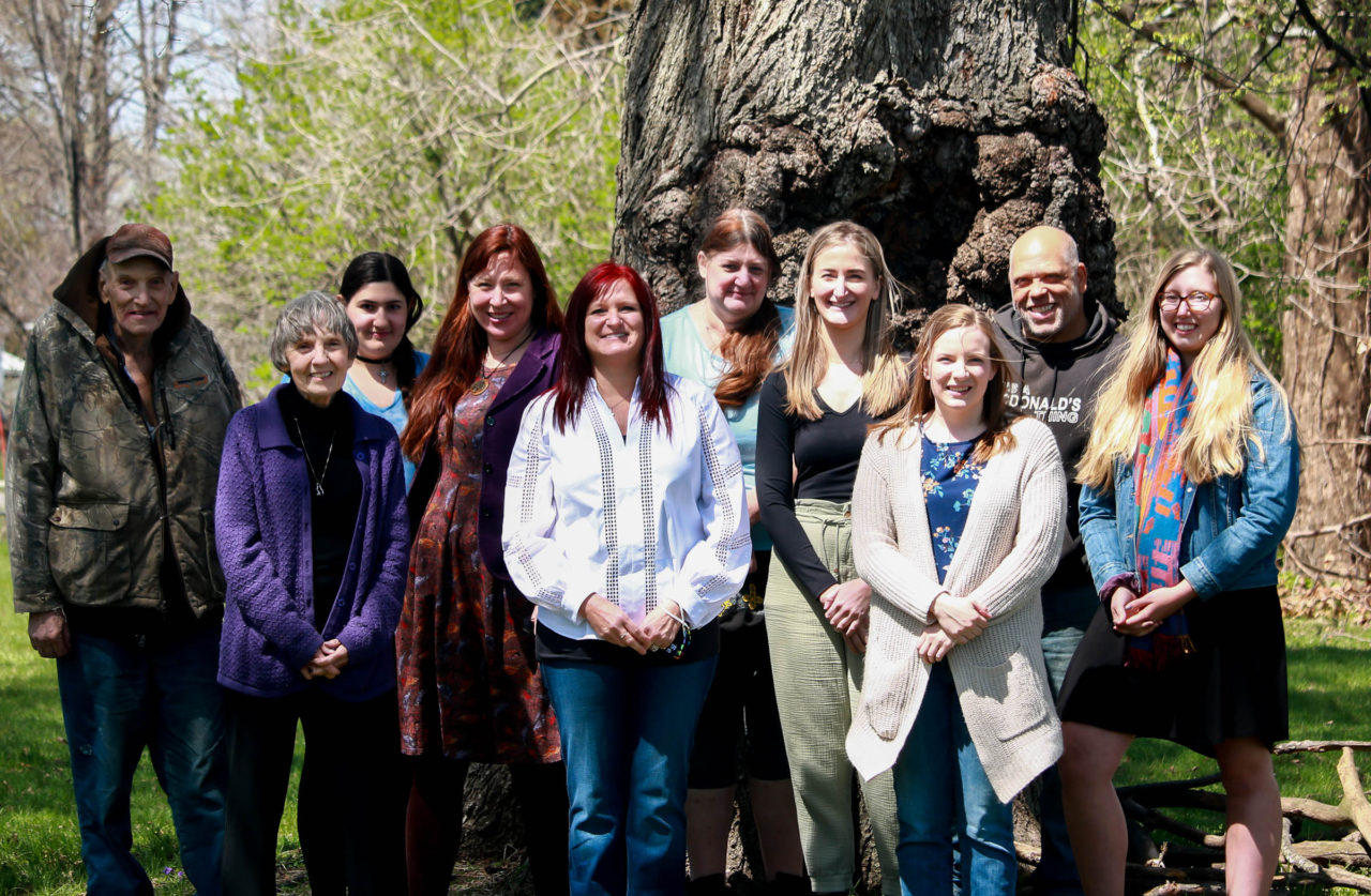 group photo in the sun of people who work at the Waterloo location